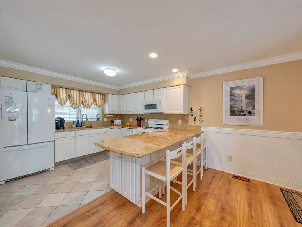 Kitchen and Counter with Bar Stools