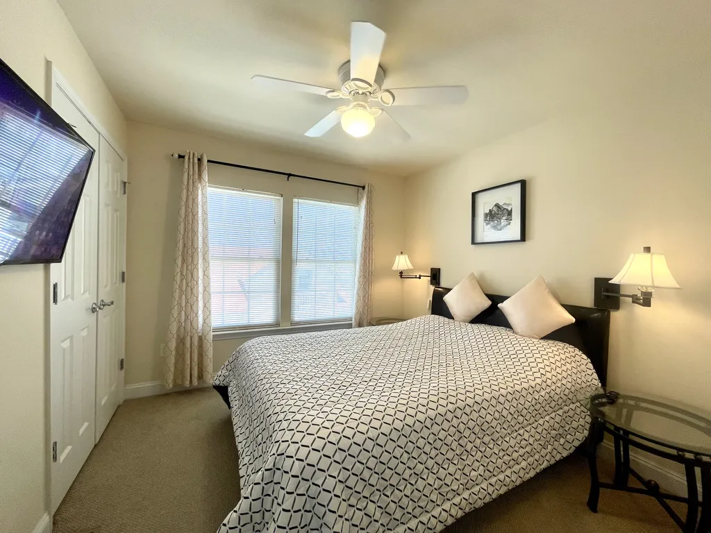 third bedroom with a queen bed