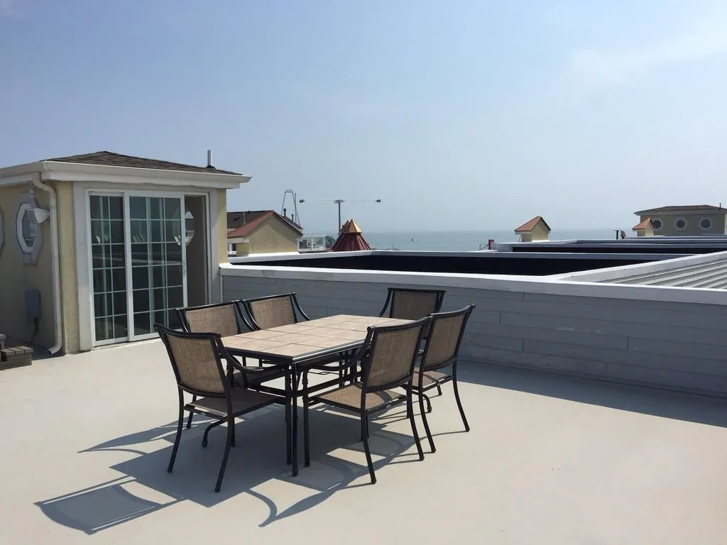 ocean view roof top area with hot tub spa