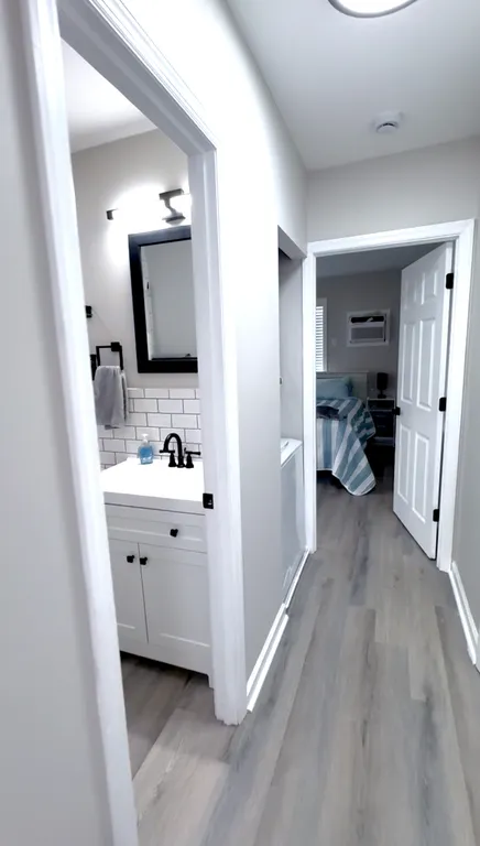 long hallway features door to sideyard.