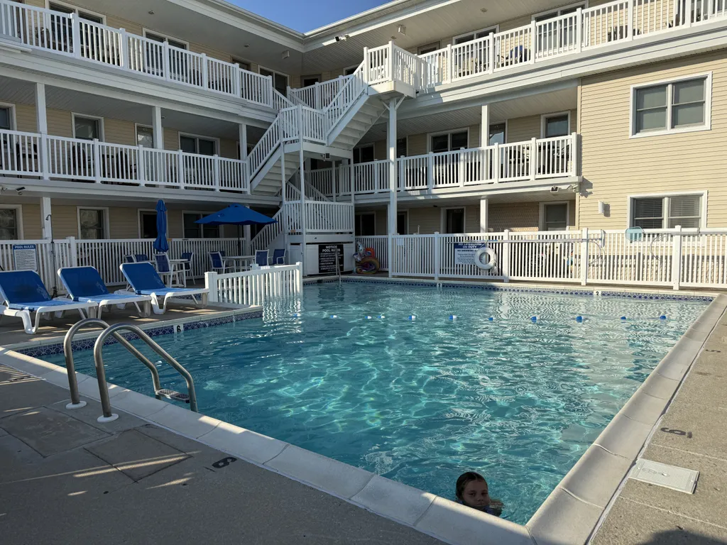 Heated pool with plenty of lounge and table seating