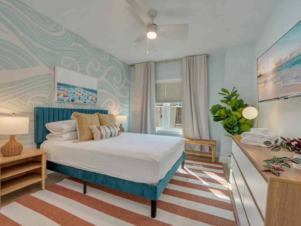 Vibrant Queen Bedroom with Bold Touches, Storage Space &amp;amp; Black Out Shades
