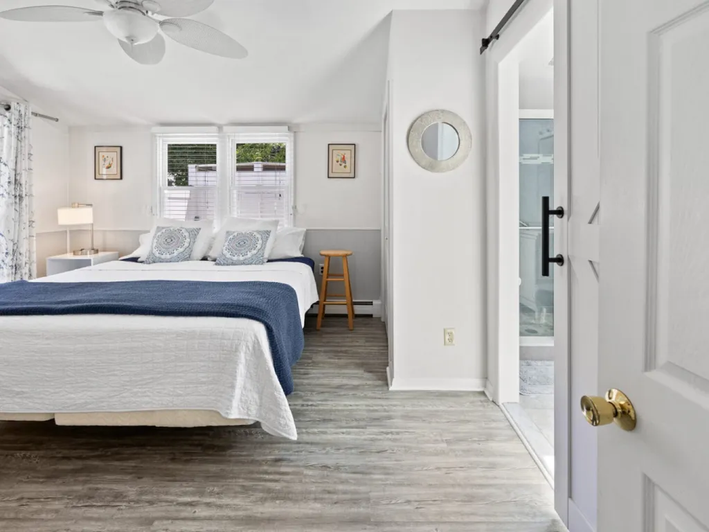 Primary Bedroom with King bed, ensuite bath and access to pool.
