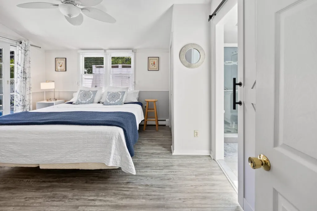 Primary Bedroom with King bed, ensuite bath and access to pool.