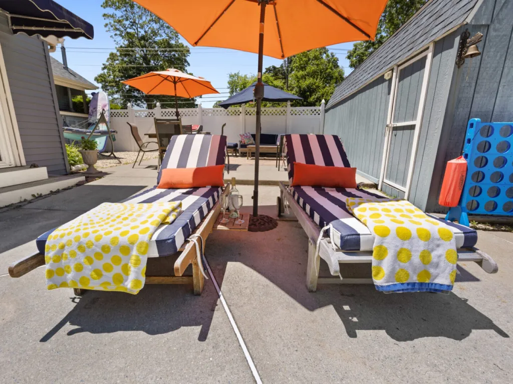 Poolside patio with chaise lounges