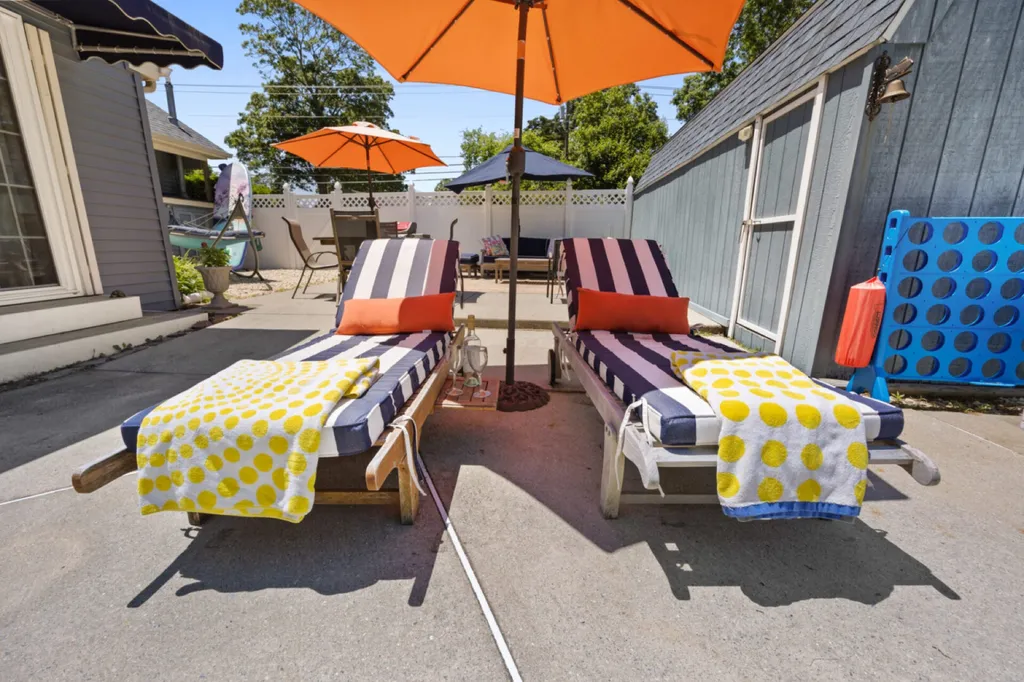 Poolside patio with chaise lounges