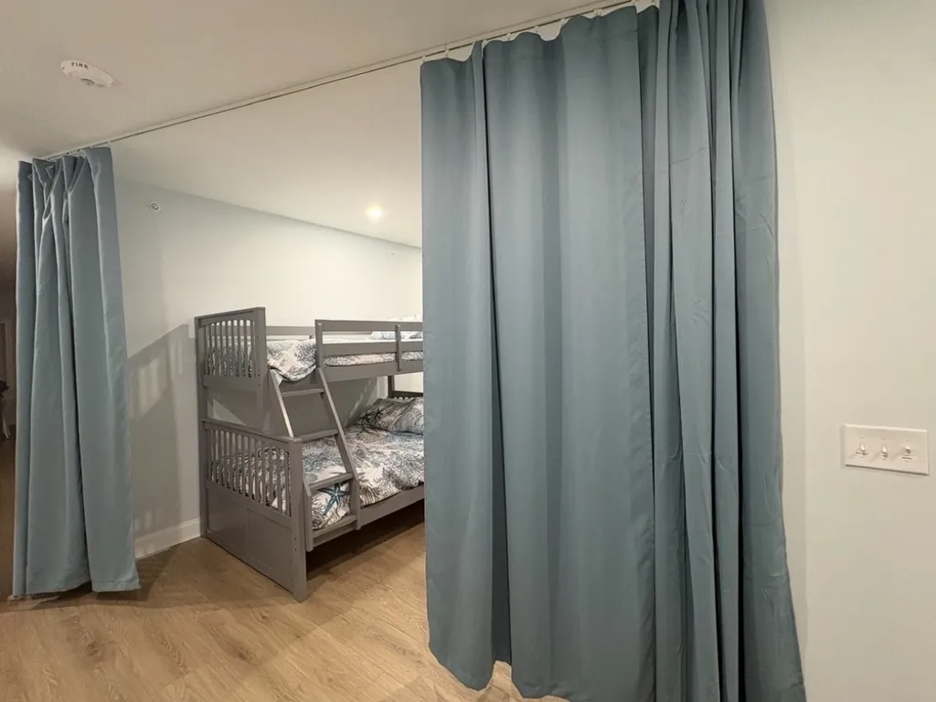 Bunkhouse has a floor to ceiling black out curtain that allows you to separate the space completely, plenty of privacy.  Perfect for all the kids to have a &amp;quot;sleepover&amp;quot; together