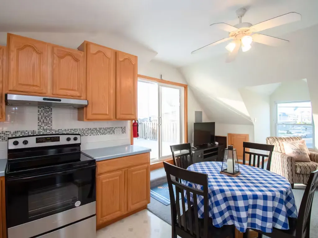 A round kitchen table that seats four is provided. The table sides collapse to provide more room when not in use