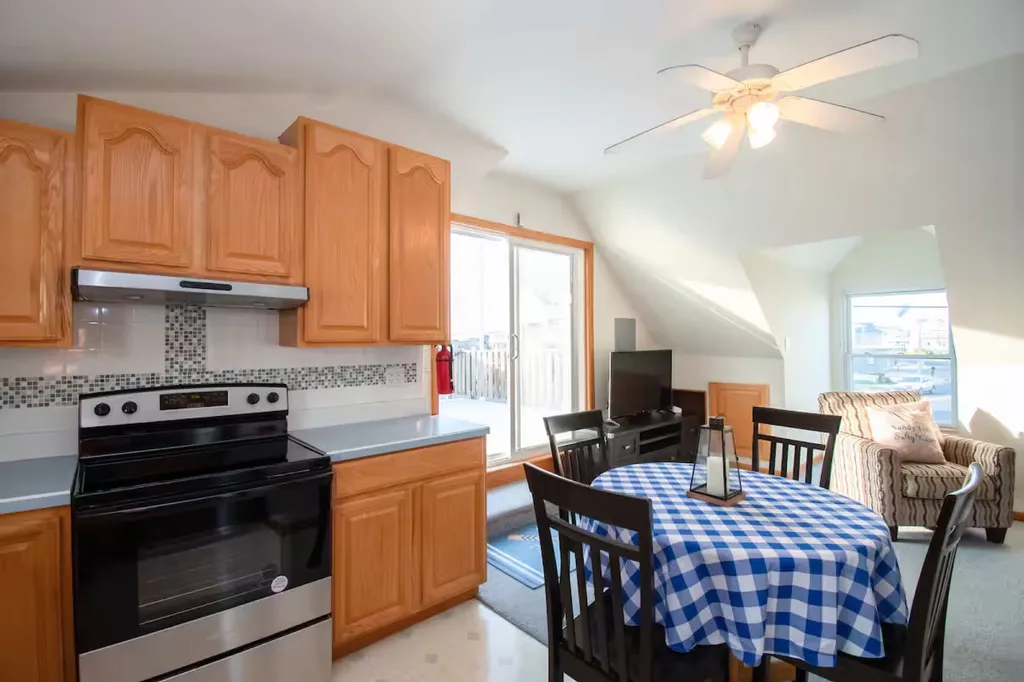 A round kitchen table that seats four is provided. The table sides collapse to provide more room when not in use