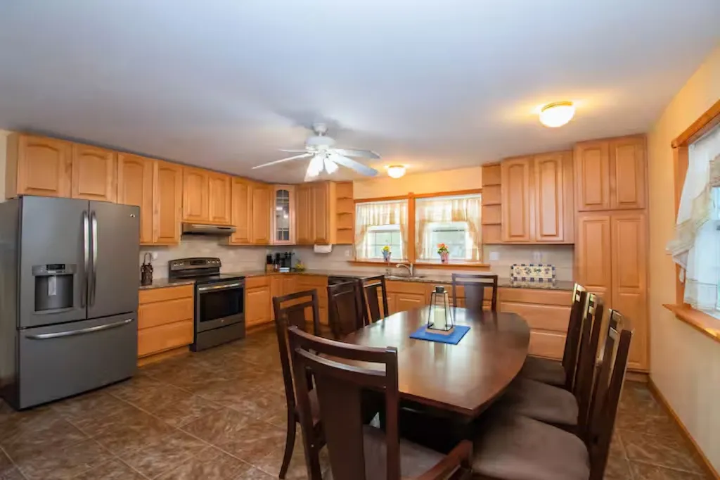 First Floor A large kitchen that is spacious and well-designed culinary haven that offers ample room for cooking, food preparation, and dining