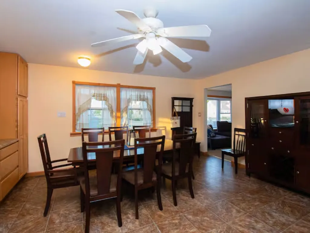 The dining area features a sturdy and stylish table, large enough to comfortably accommodate your group