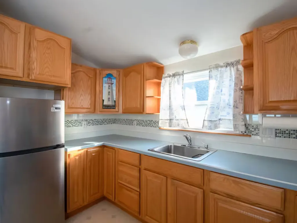 The brand new refrigerator is located in the kitchen on the second floor.