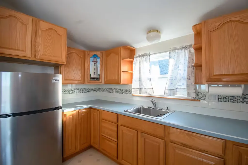 The brand new refrigerator is located in the kitchen on the second floor.