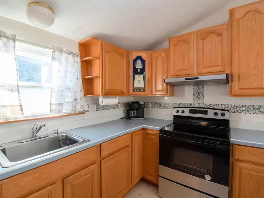 The beach kitchen is equipped with a new oven.