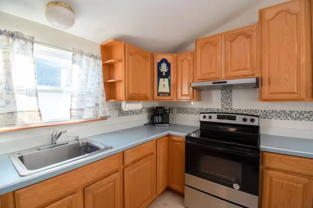 The beach kitchen is equipped with a new oven.