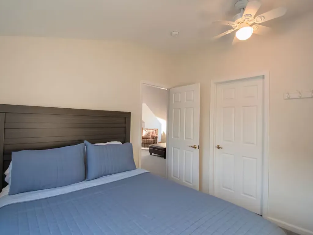 Queen size bed with bureau and black out curtains