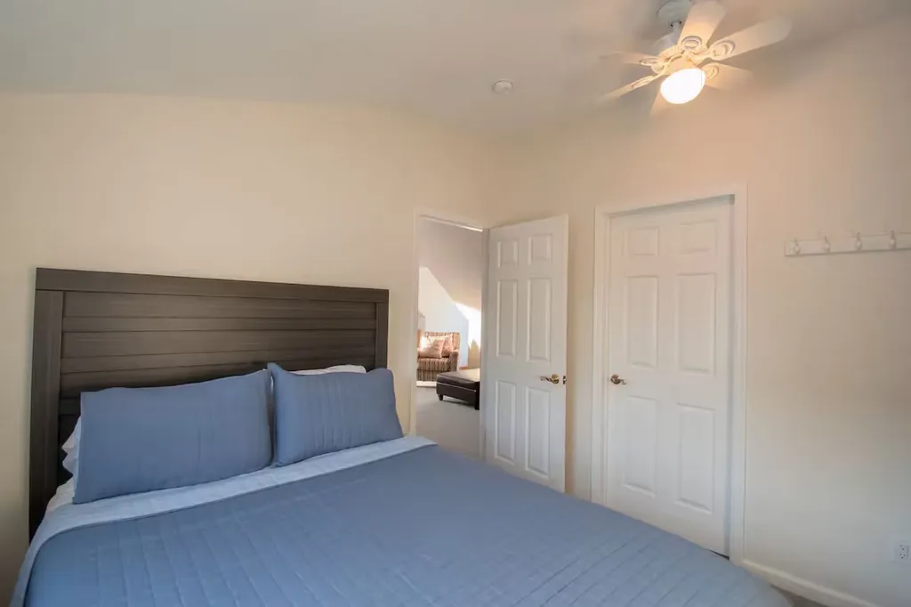 Queen size bed with bureau and black out curtains