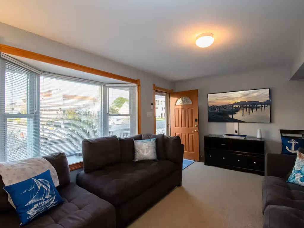 Plenty of seating in the living room with 64 inch Flat Screen TV- UTube TV and Wi-Fi available for streaming your favorite apps