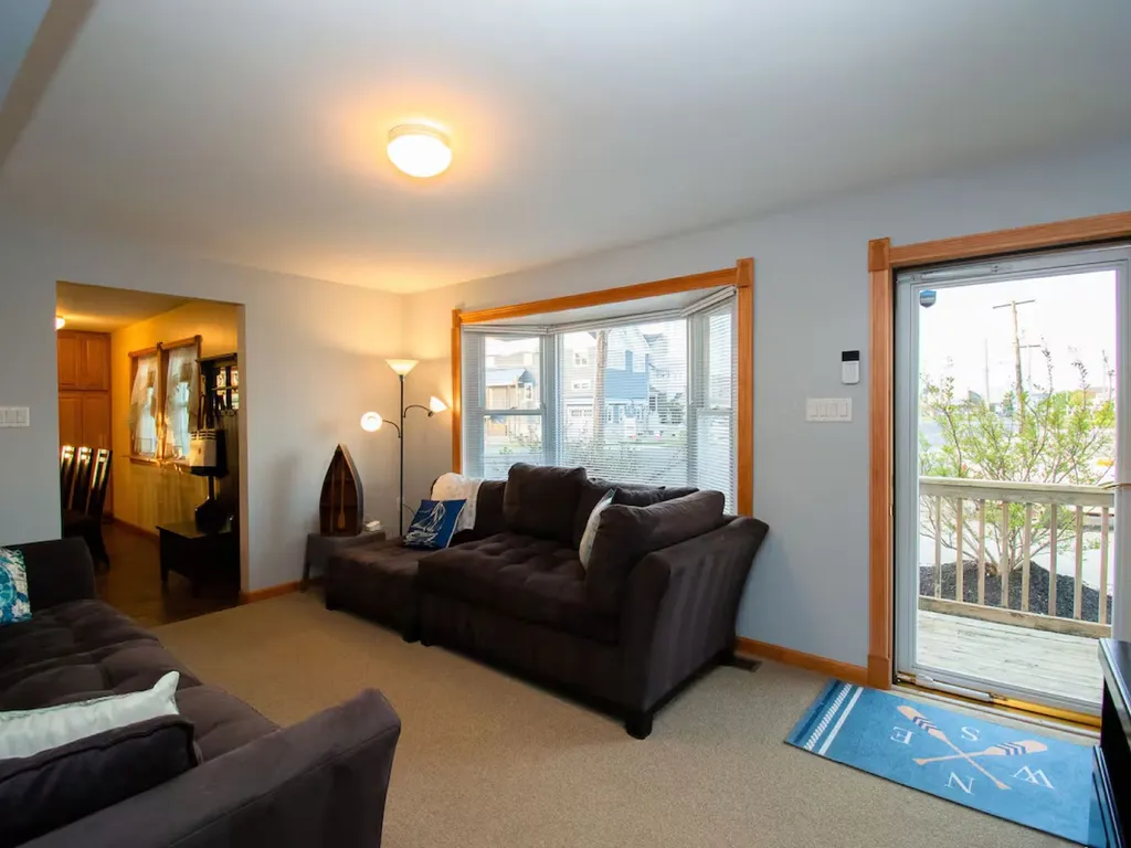 This is one of my favorite spots to relax on the sofa overlooking the picture window and gaze at the bay! The front door enters here