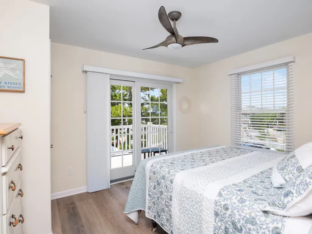 First floor queen bedroom - slder opens to backyard deck.