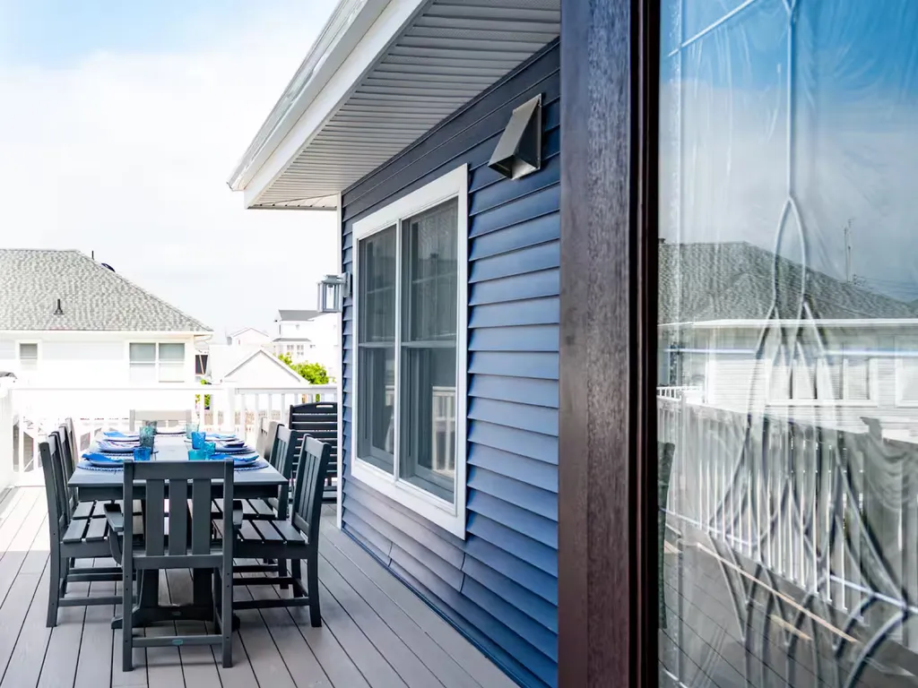 Outside dining - first floor - deck outside kitchen main floor - umbrella provided.
