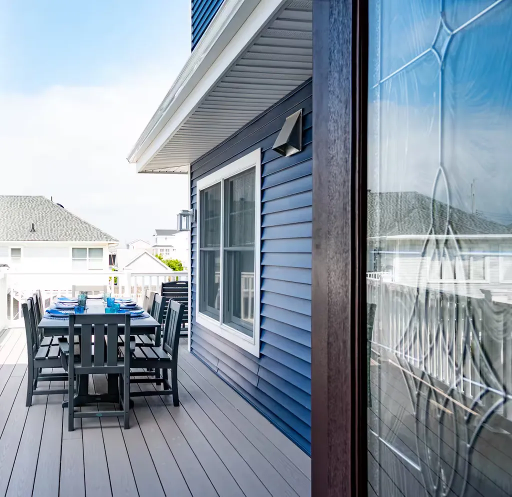 Outside dining - first floor - deck outside kitchen main floor - umbrella provided.