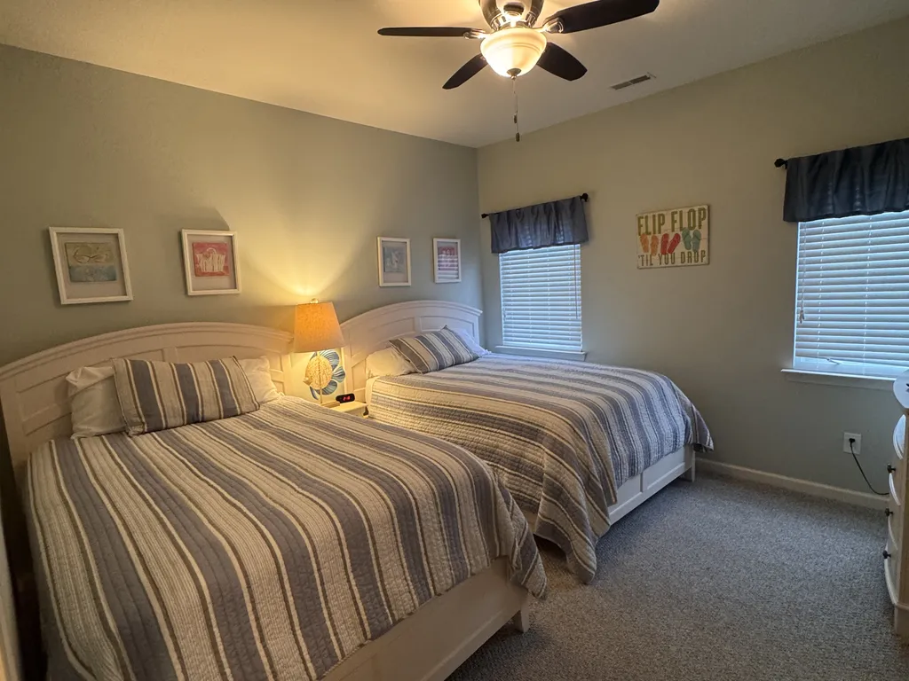 Bedroom #2 with two Full Size beds, a power tower on the nightstand and 43&amp;quot; smart TV