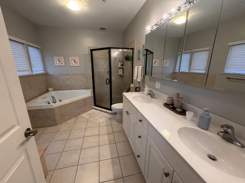 Large double vanity master bathroom with soaking tub