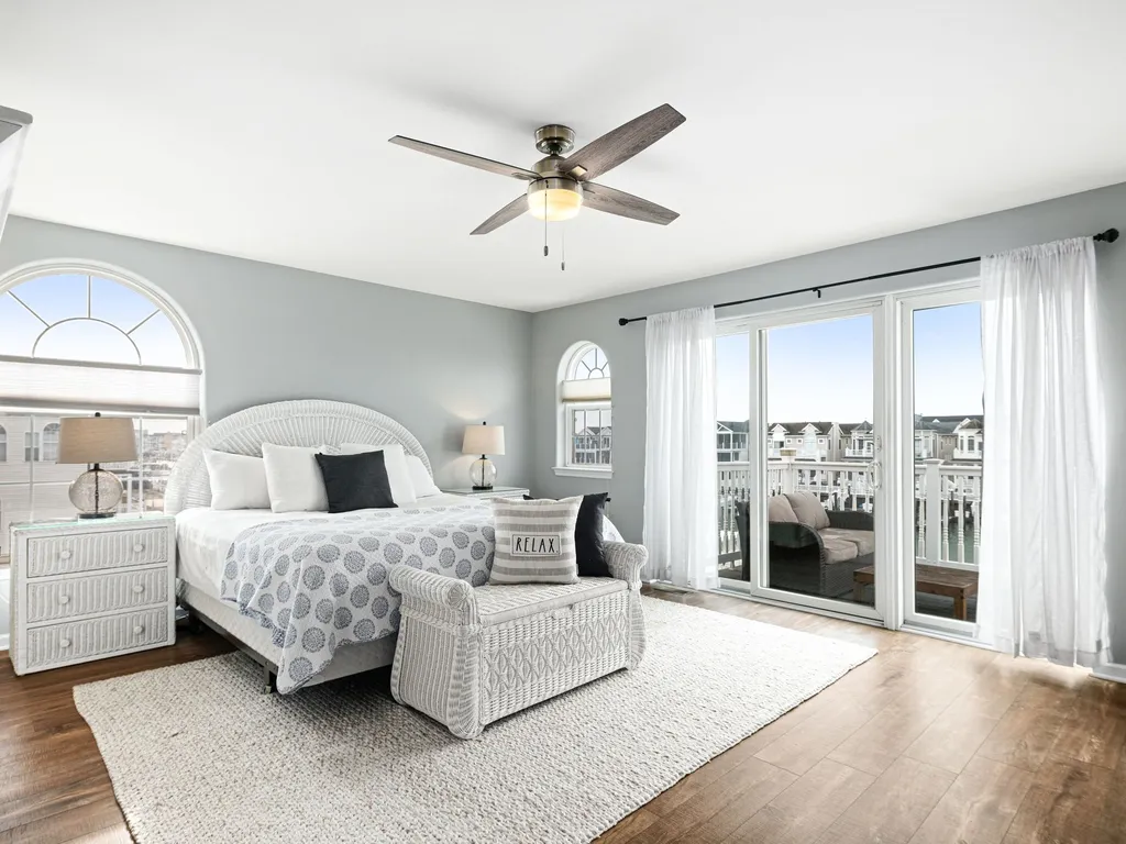 master suite with private bathroom and deck