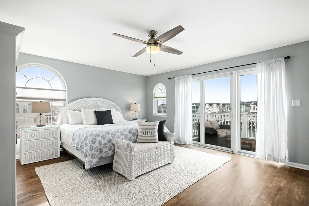 master suite with private bathroom and deck