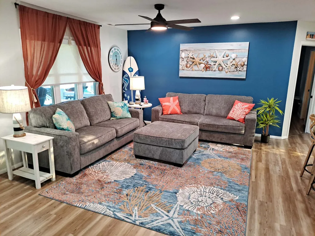 Relax and unwind in our comfortable and stylish living room, featuring plenty of seating for all.
