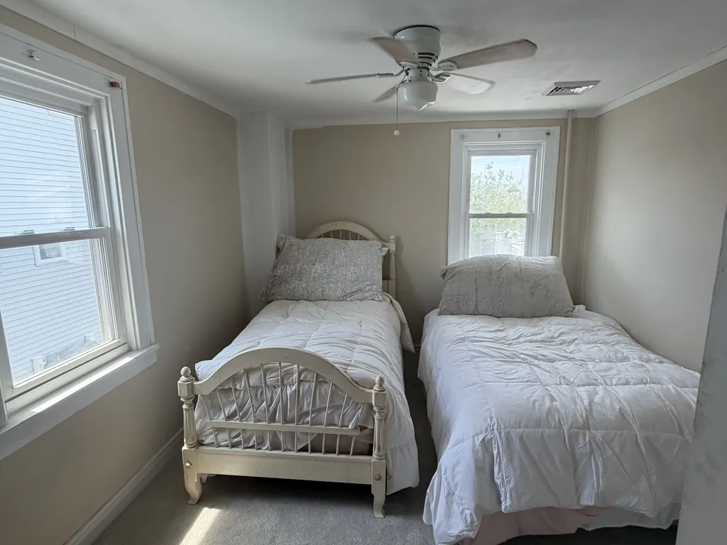 Upstairs bedroom with closet and dresser