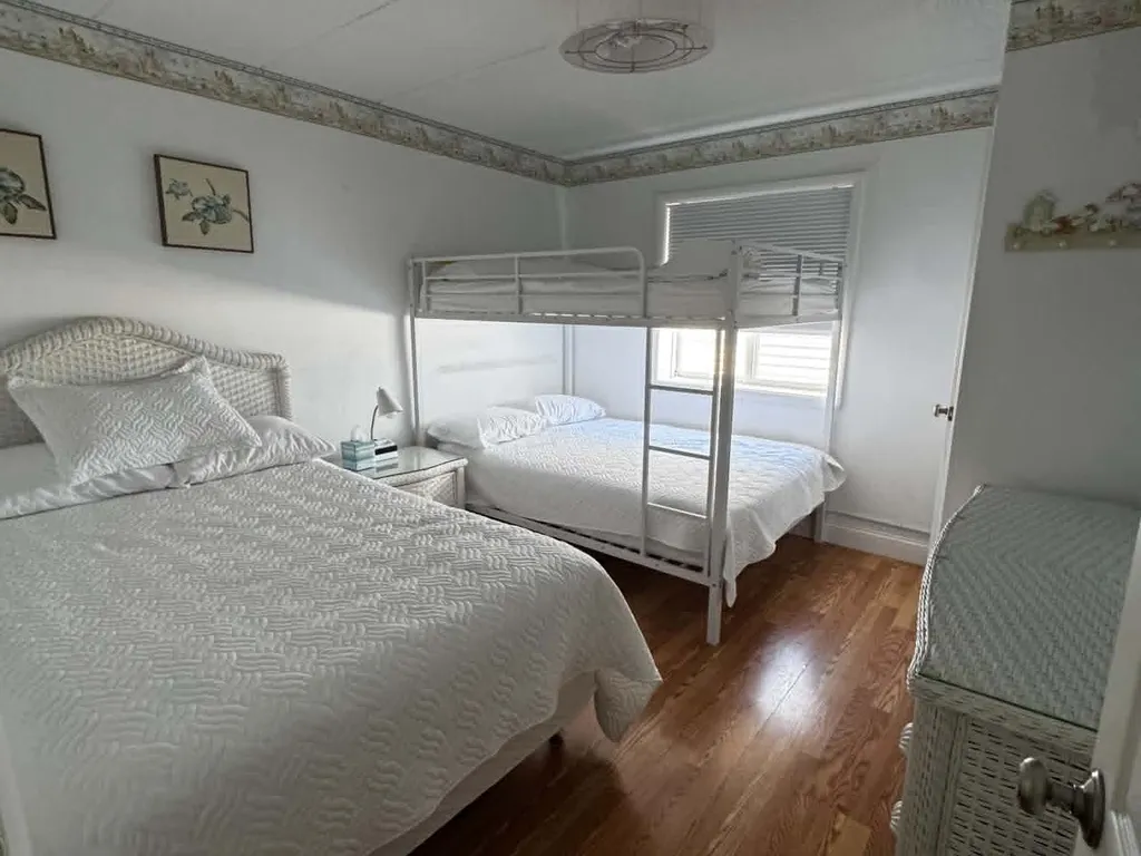 2nd Bedroom has 3 full size beds and smart TV