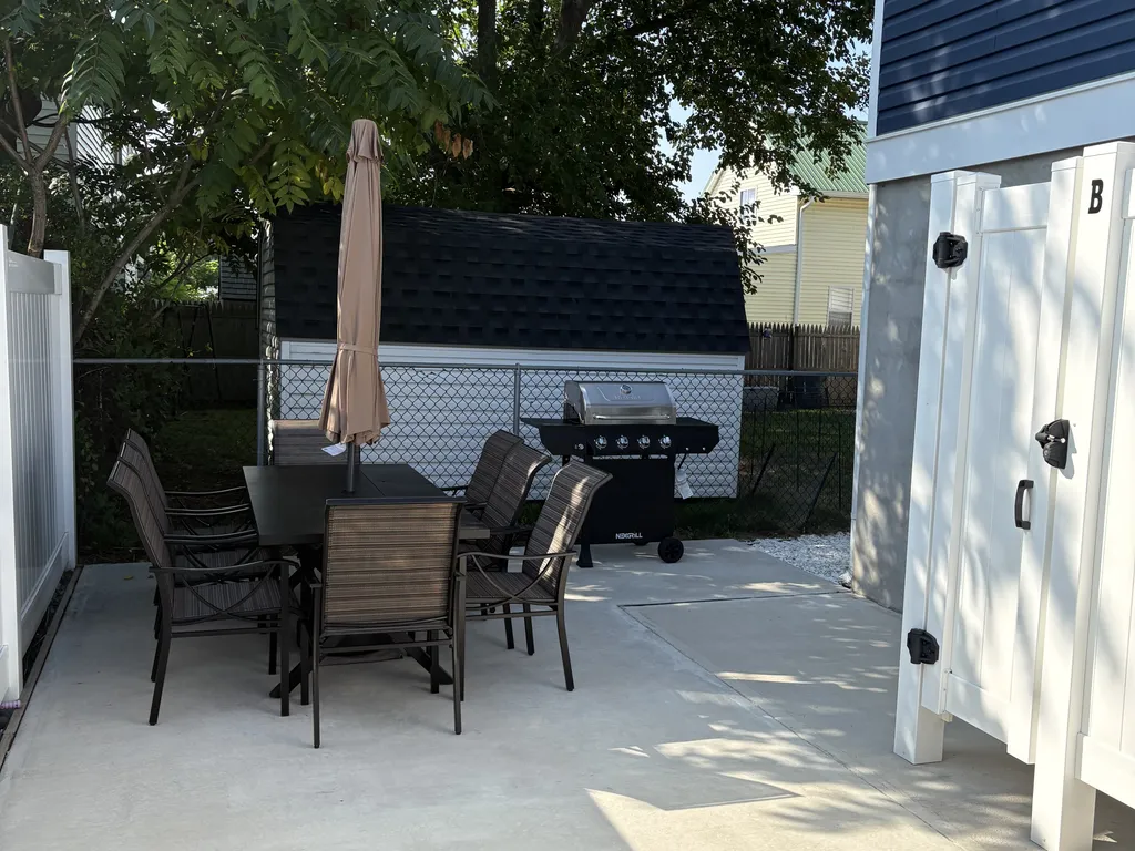 Outdoor patio with BBQ grill and 8 person seating 