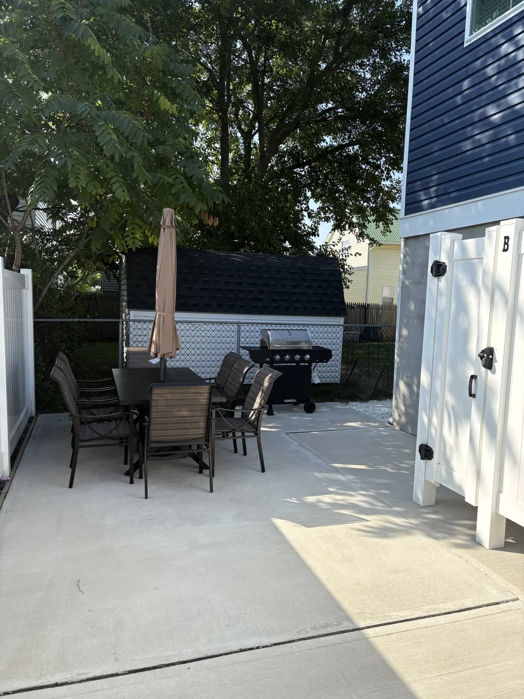 Outdoor patio with BBQ grill and 8 person seating 