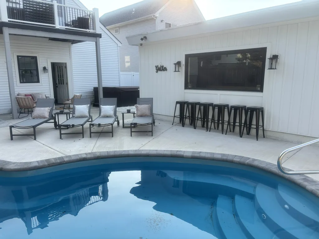 Backyard Bar and Pool- the window opens up!