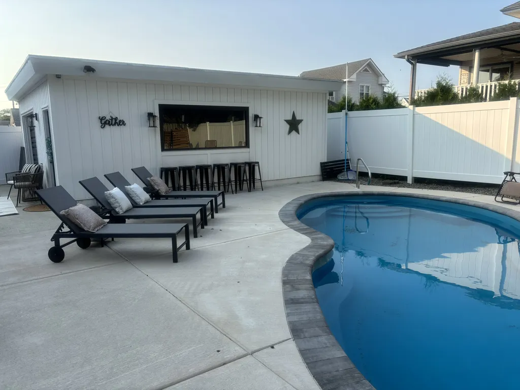 Backyard Bar and Pool- the window opens up!