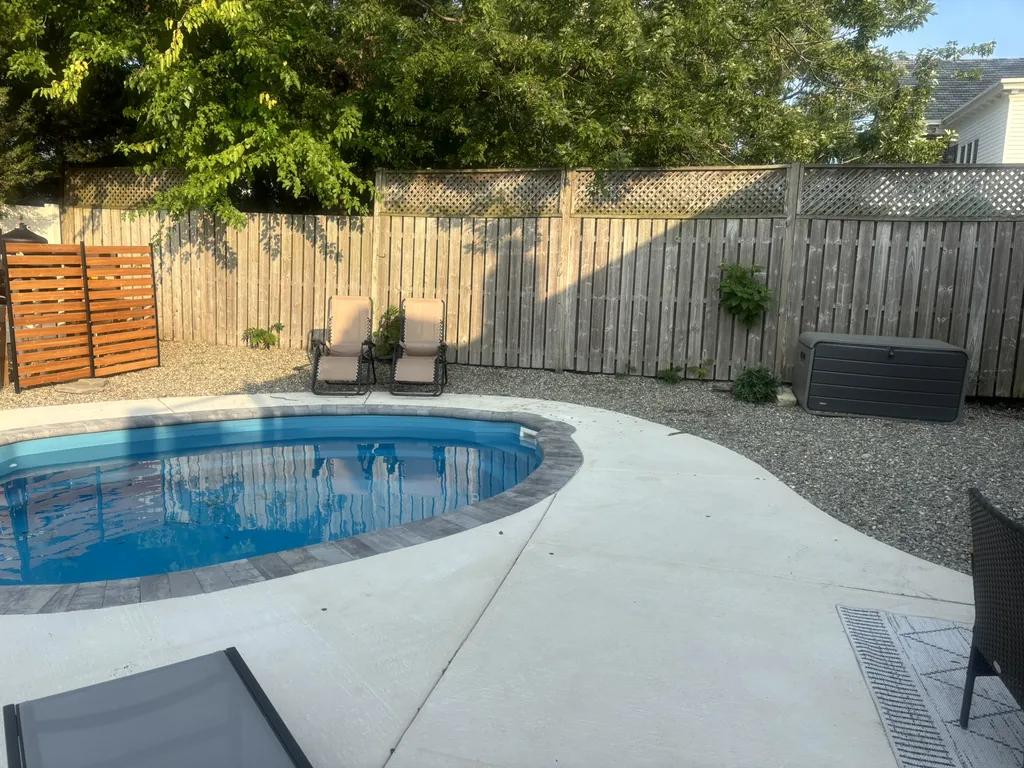 In-ground pool in a large fenced-in backyard. Bring your pup!