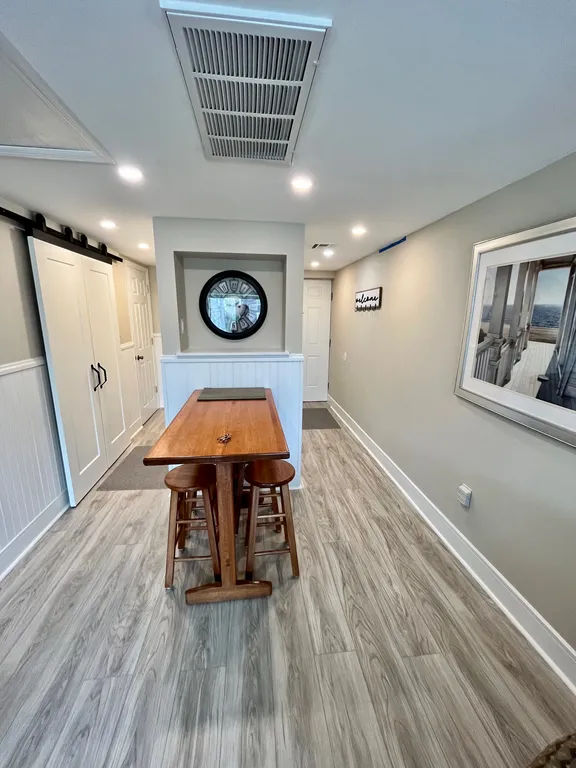View of Foyer &amp;amp; Bathroom Hallway from Living Room