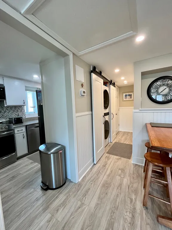 Family room view of kitchen &amp;amp; bathroom washer/dryer