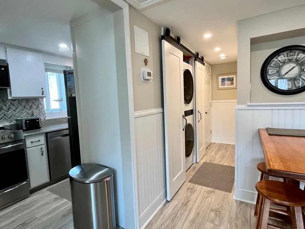 Family room view of kitchen &amp;amp; bathroom washer/dryer