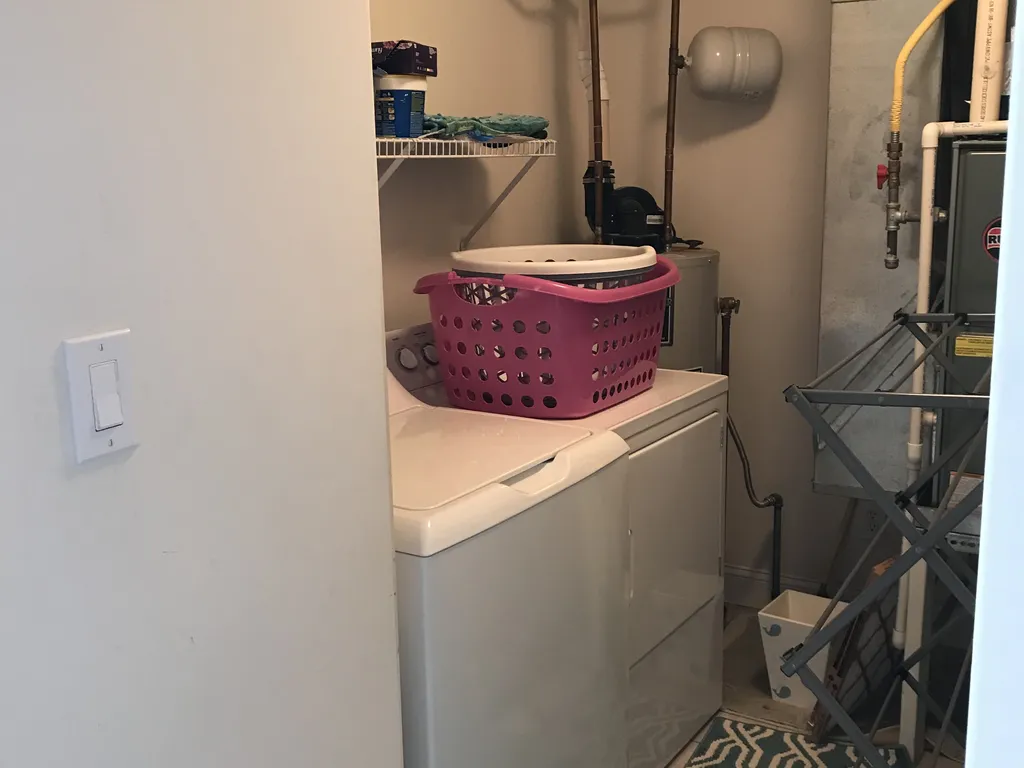 Full size washer and dryer in separate laundry room