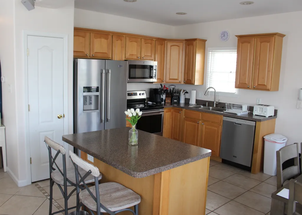 Kitchen with island bar stools