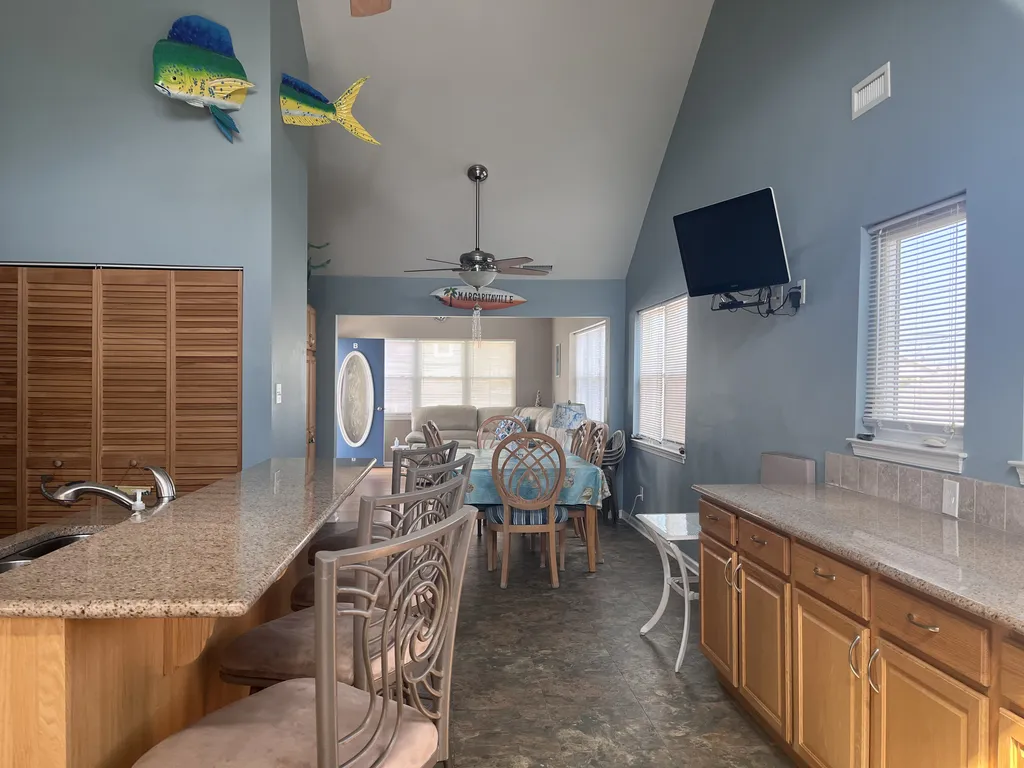 Kitchen looking to dining area and living room