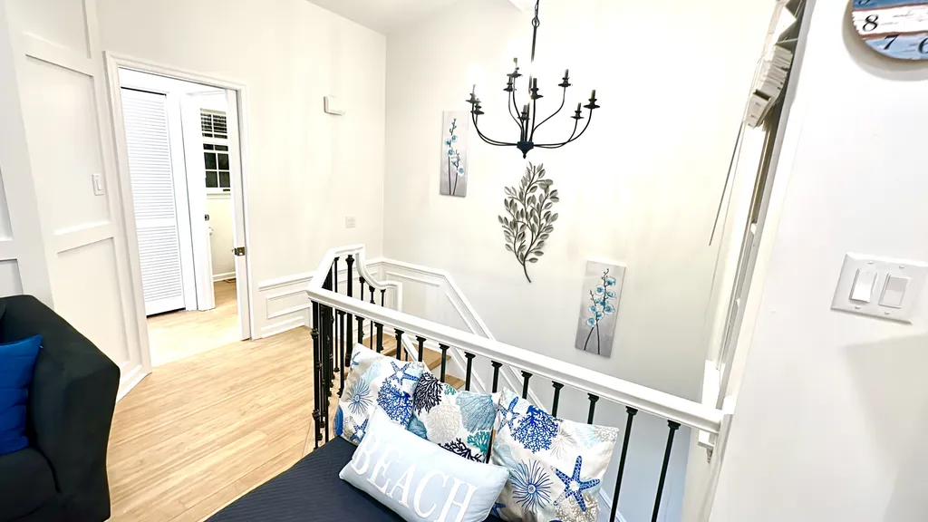 view of pocket door leading to hallway with 4th bedroom and 1/2 bath