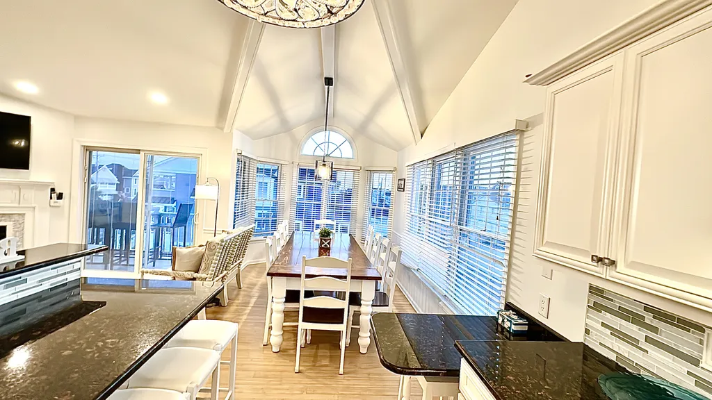 Dining Room with 12 person farm table plus seating for 6 at two counters