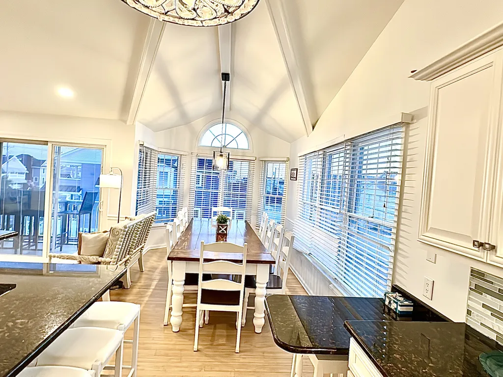 Dining Room with 12 person farm table plus seating for 6 at two counters