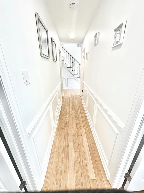hall way with bedrooms 3 of 4 bedrooms on lower level