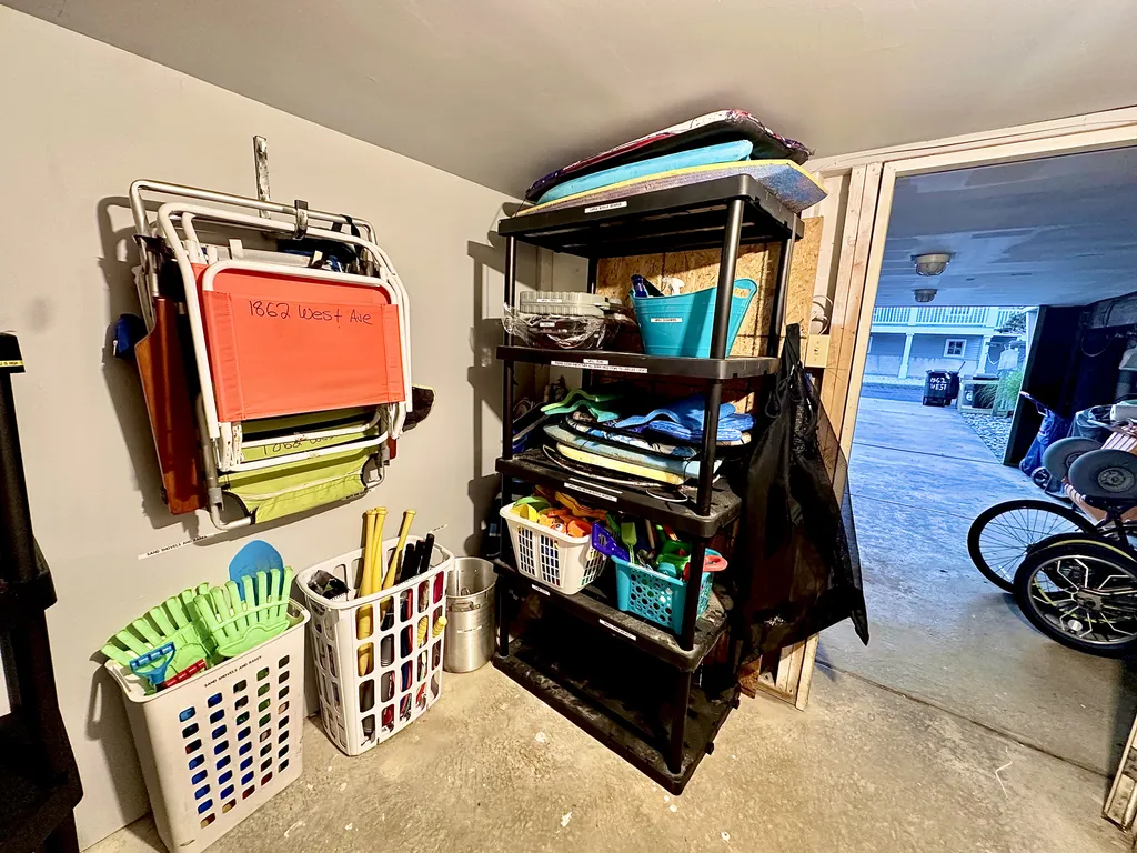 Storage room that locks with beach chairs, beach, toys, and beach equipment.