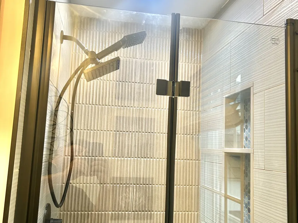 BRAND NEW Shower for 3rd full bath on 2nd floor. Pocket door can be closed to make it an en-suite for 2nd floor full bunk room or left open to give access to hall.